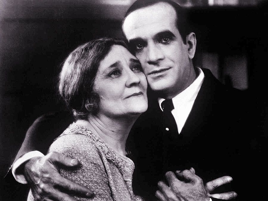 The Jazz Singer (1927) Actor Al Jolson as Jakie Rabinowitz with Eugenie Besserer, who plays his mother as Sara Rabinowitz in a scene from the musical film directed by Alan Crosland. First feature-length movie with synchronized dialogue.  The Jazz Singer