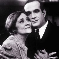 The Jazz Singer (1927) Actor Al Jolson as Jakie Rabinowitz with Eugenie Besserer, who plays his mother as Sara Rabinowitz in a scene from the musical film directed by Alan Crosland. First feature-length movie with synchronized dialogue.  The Jazz Singer