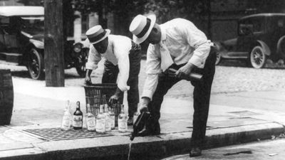 Prohibition - Whisky is poured down a sewer during Prohibition in the 1920s in the United States.