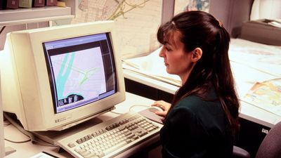 Computer mapping, woman at early 1990s computer